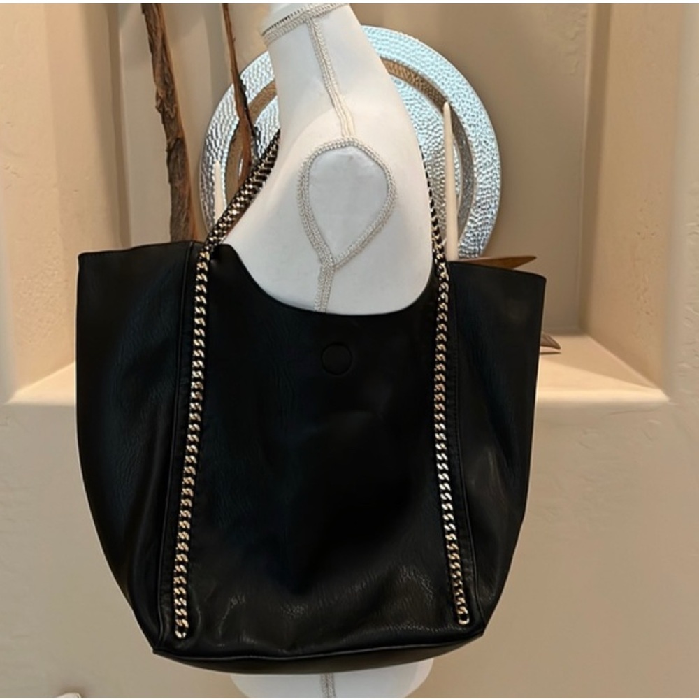 Nwot. Madison west purse and matching travel
Bag.